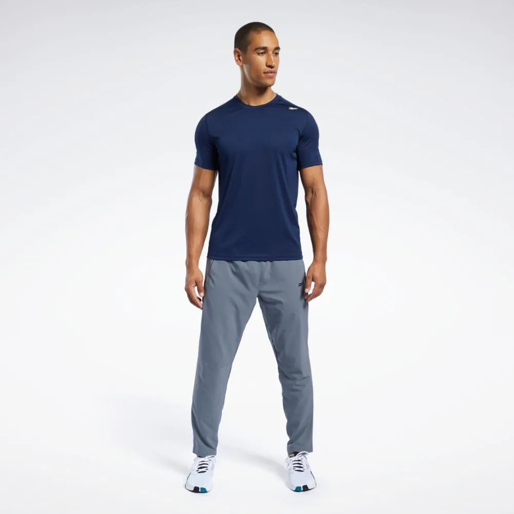 Reebok Apparel  Men's Id Train Woven Pant Reebok Training App Men Cold Grey 6 Reg